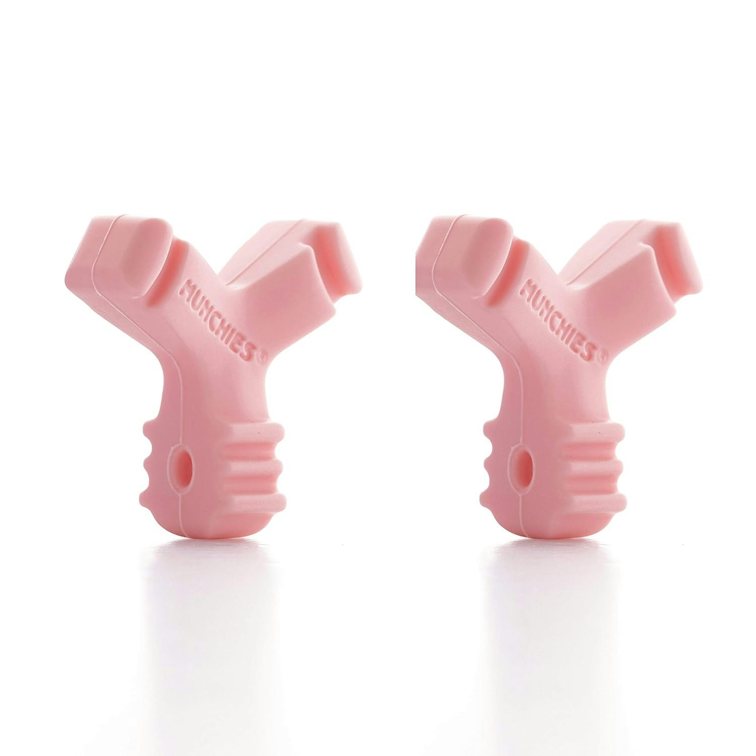 Two pink Munchies chewies for seating Invisalign aligners