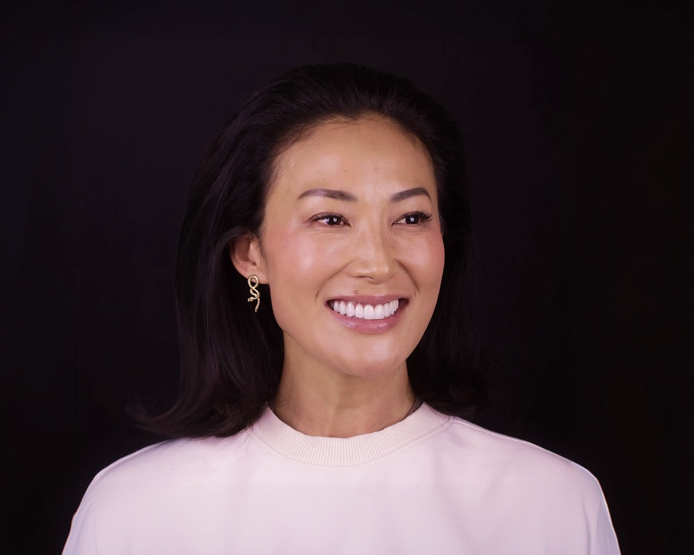 Patient smiling after porcelain veneers at Oh Aesthetic Dentistry in Los Angeles